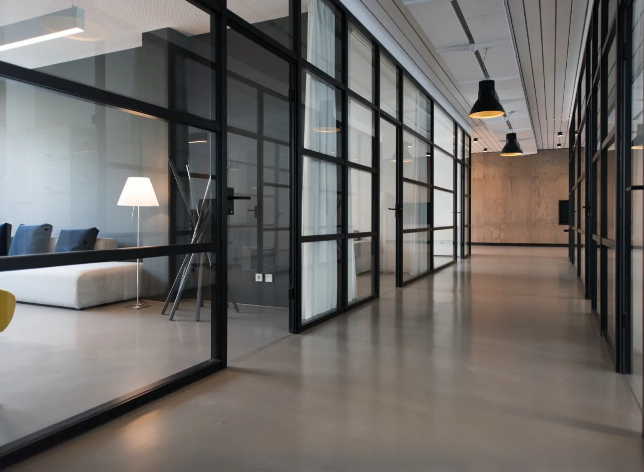 A bright open-plan office with empty workstations — representing the opportunity to monetise unused commercial office space in New Zealand