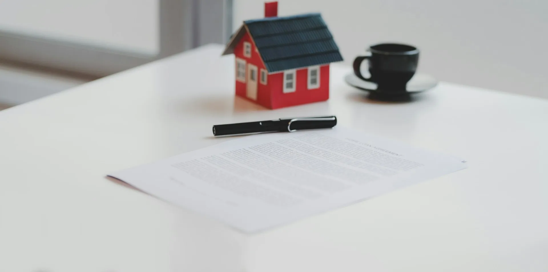 Commercial property lease documents on a desk with a calculator