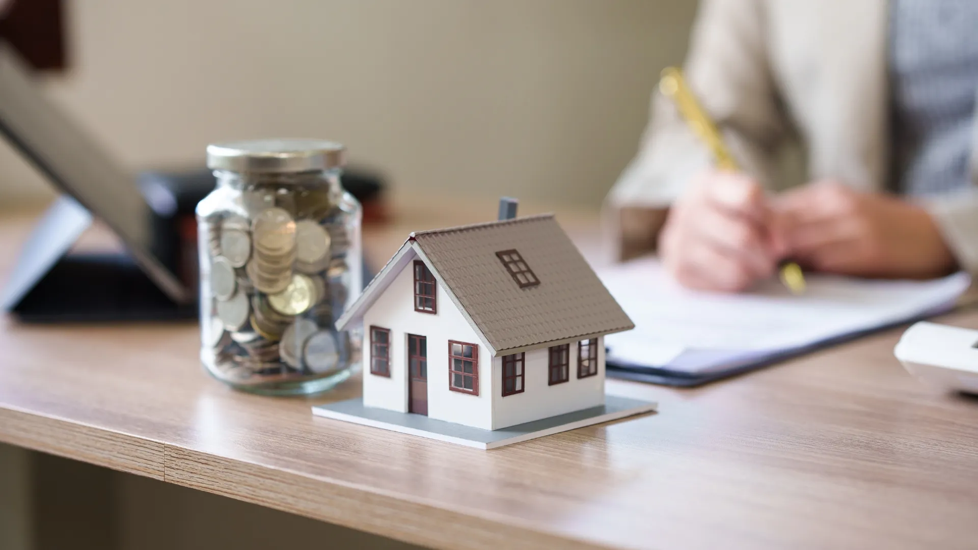 New Zealand property purchase deposit concept — keys on a contract with a calculator