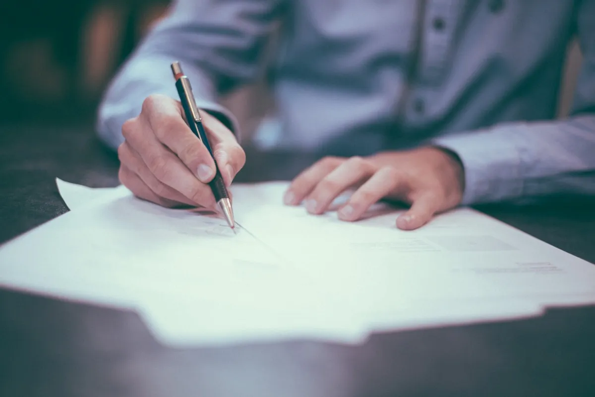 Property documents and legal paperwork being reviewed at a desk